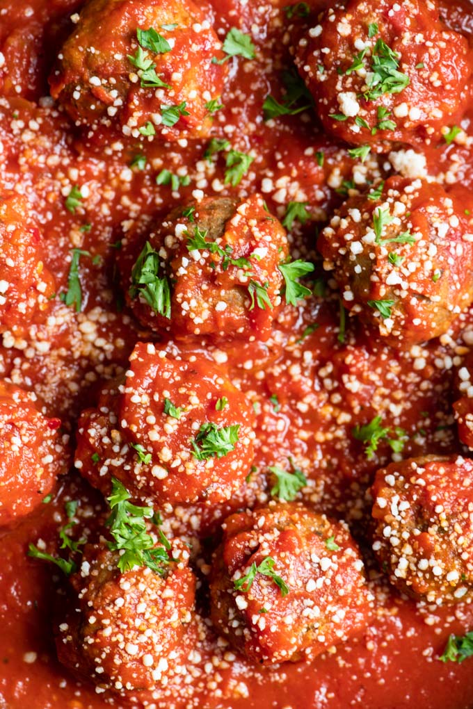 close up of vegan meatballs in tomato sauce