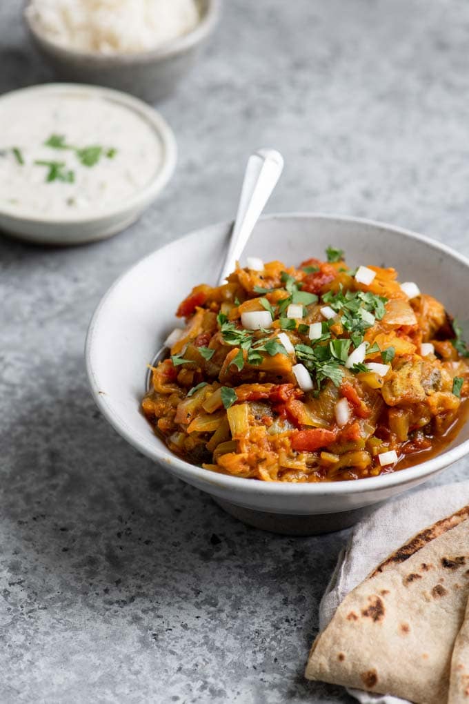 Indian mashed eggplant, with flatbread (chapati), rice, and yogurt