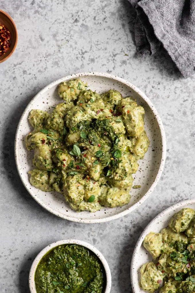 two bowls of vegan pesto cream gnocchi