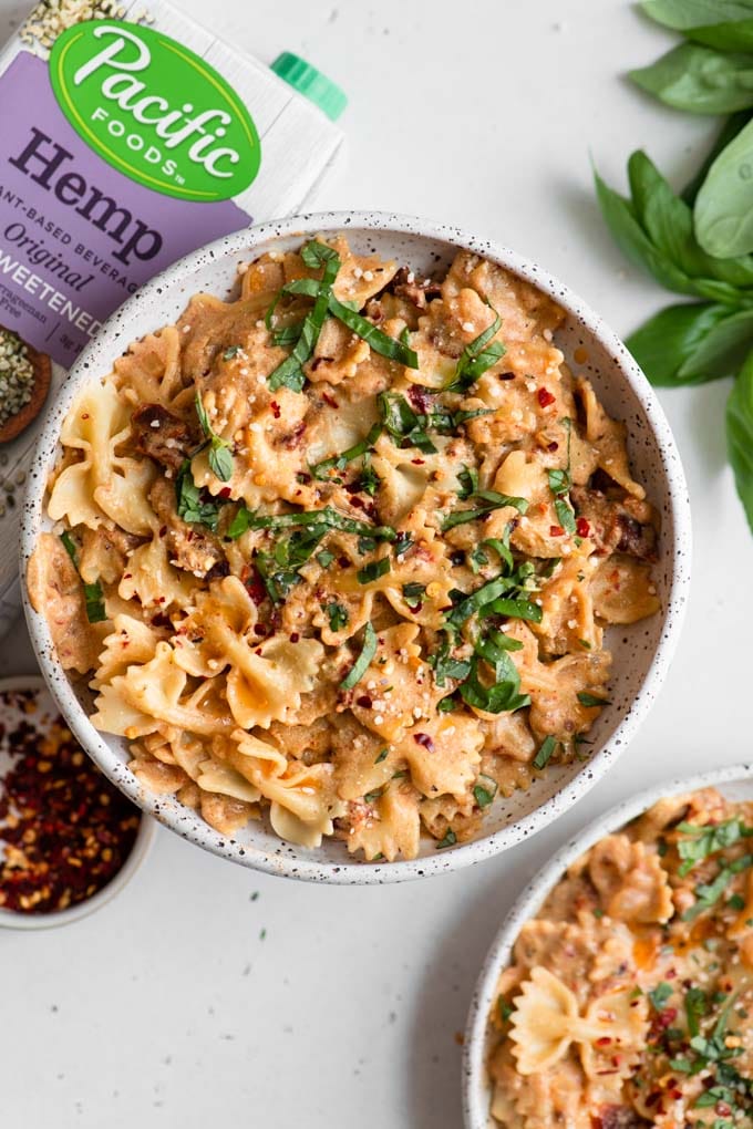 sun dried tomato cream pasta with a box of unsweetened hemp milk