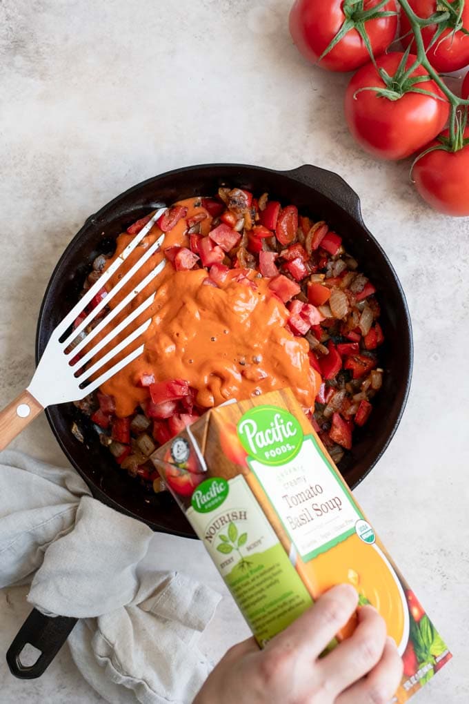 adding pacific foods soup to skillet