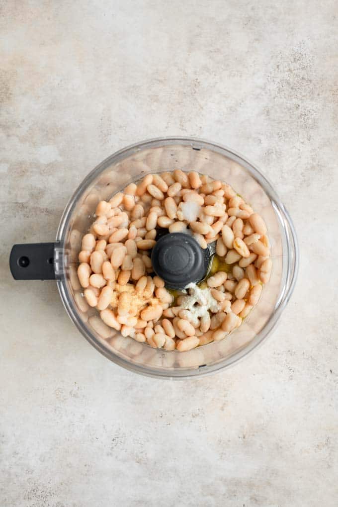 white bean dip ingredients in food processor before blending
