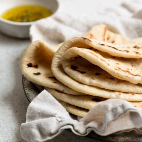 homemade flatbreads stacked with the top three breads folded in half