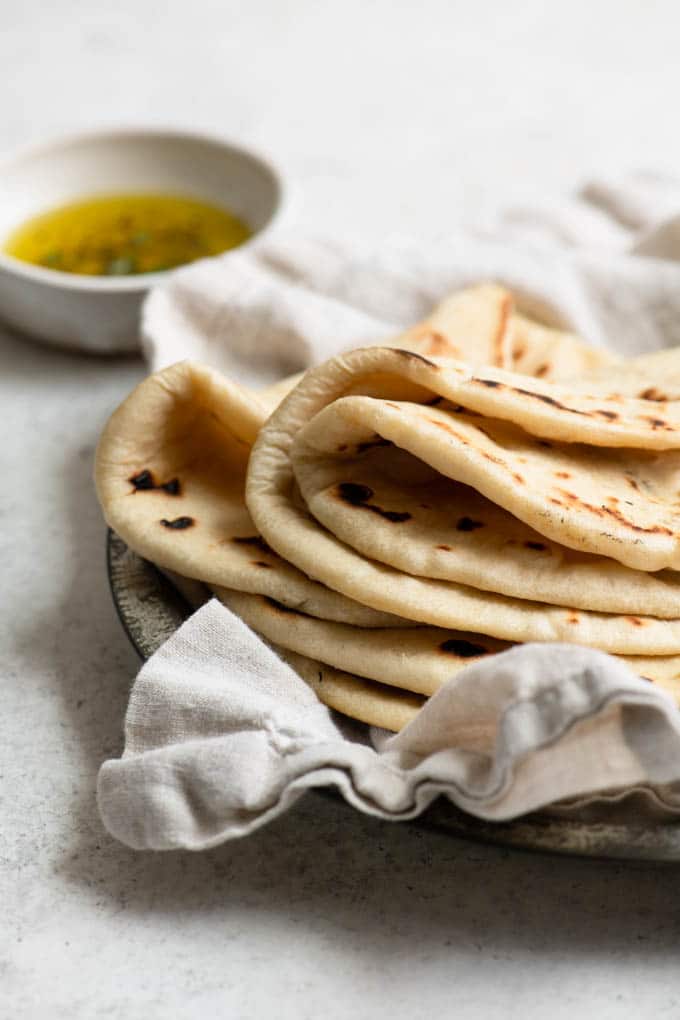 homemade flatbreads stacked with the top three breads folded in half