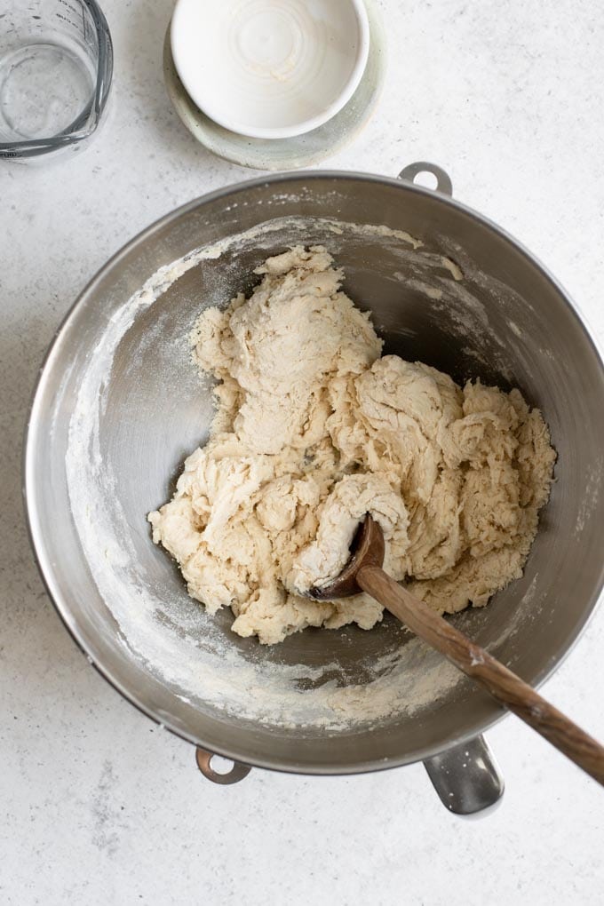 dough mixed with wooden spoon until shaggy