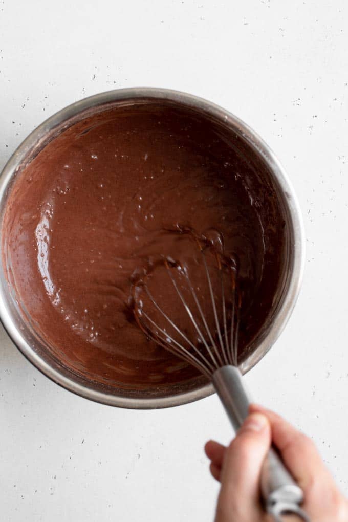 whisking vegan chocolate cake batter