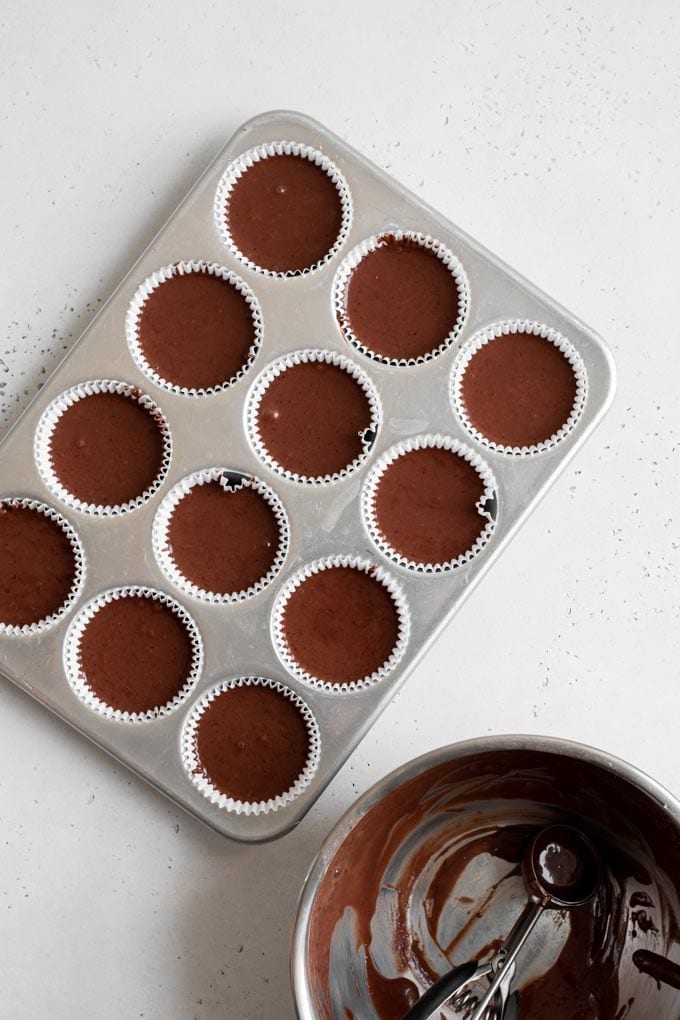 cake batter poured into cupcake tin