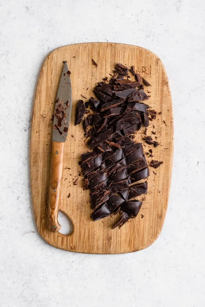 chopped dark chocolate on cutting board