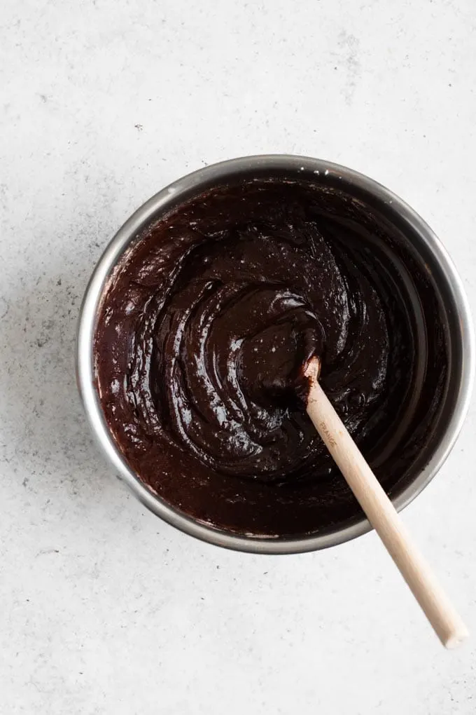 thick brownie batter stirred in a mixing bowl