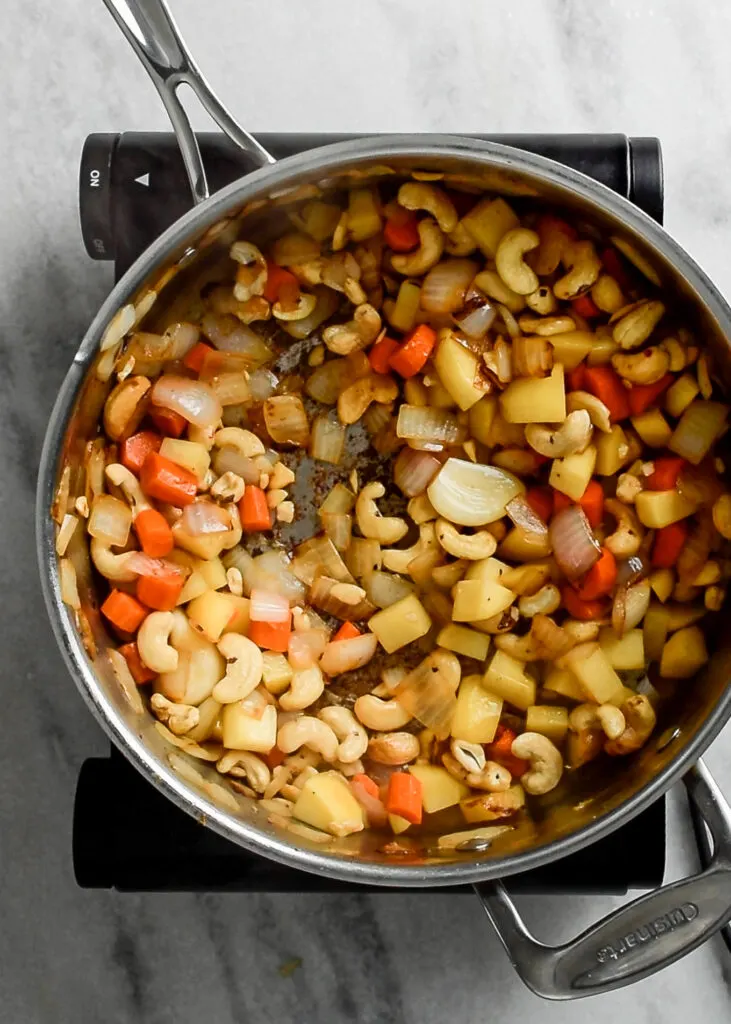 cashews and vegetables sautéd in the pot