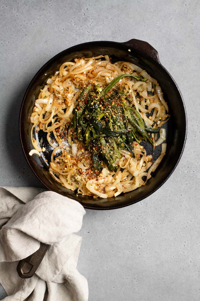 sautéed onions with poblano strips added to skillet