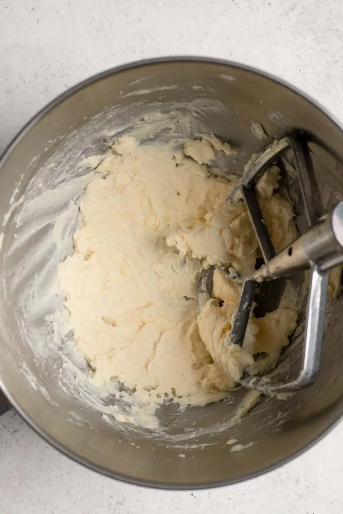 whipped vegan butter and shortening in stand mixer bowl with paddle attachment
