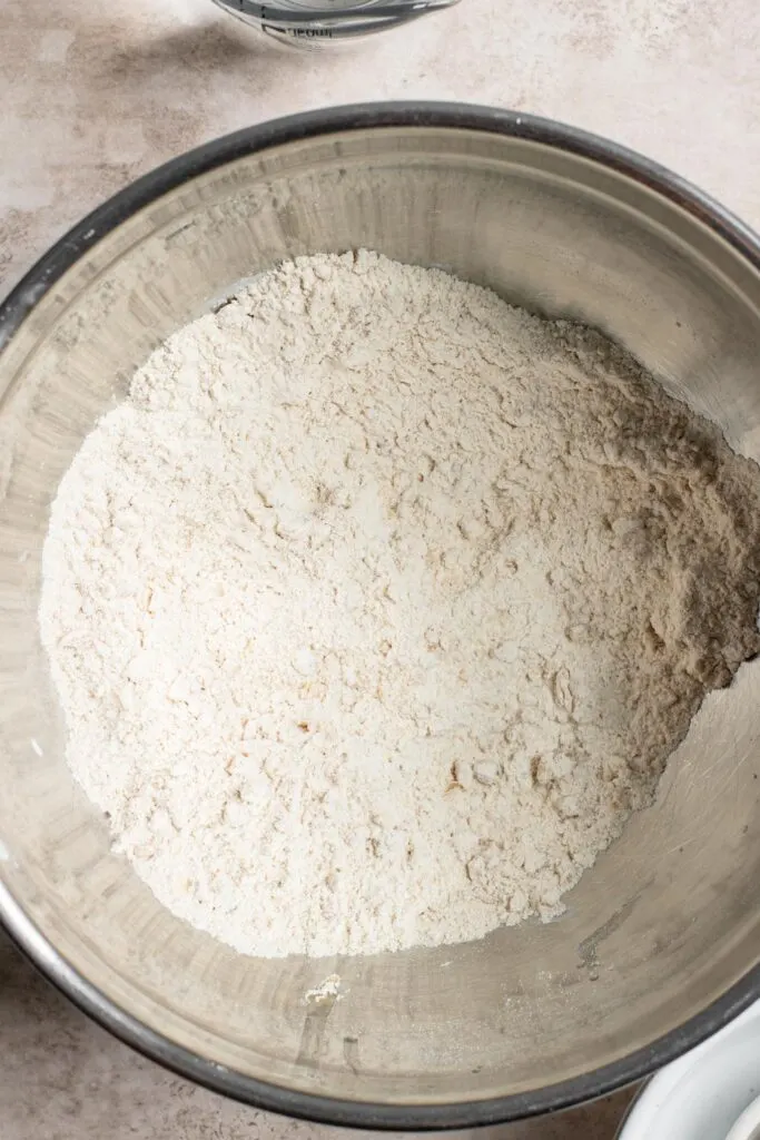 atta flour, salt, and oil combined in mixing bowl