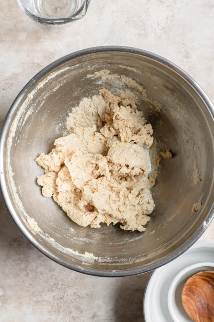 water mixed in to make shaggy dough in mixing bowl