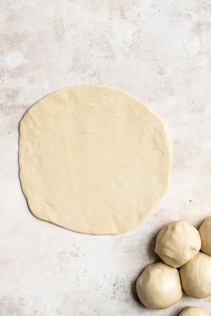 roti dough rolled into circle before cooking