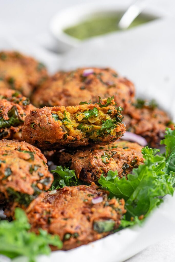 bite shot of kale pakoras