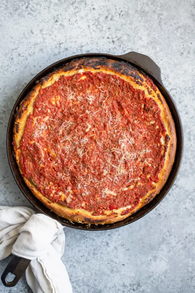 chicago-style deep dish pizza baked in a cast iron skillet