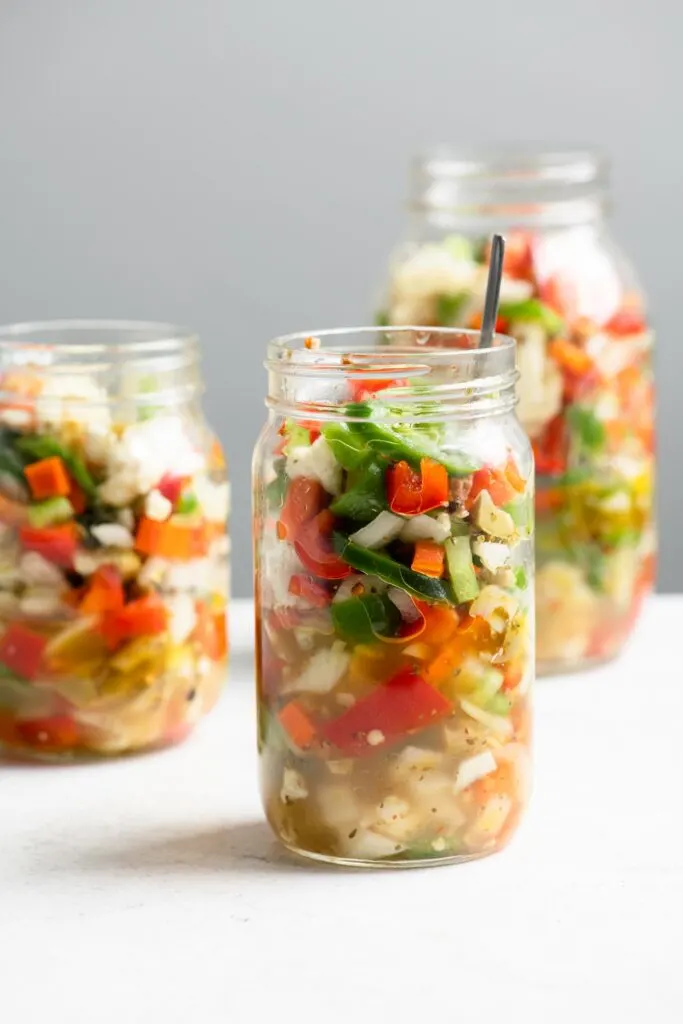 homemade giardiniera in three glass mason jars