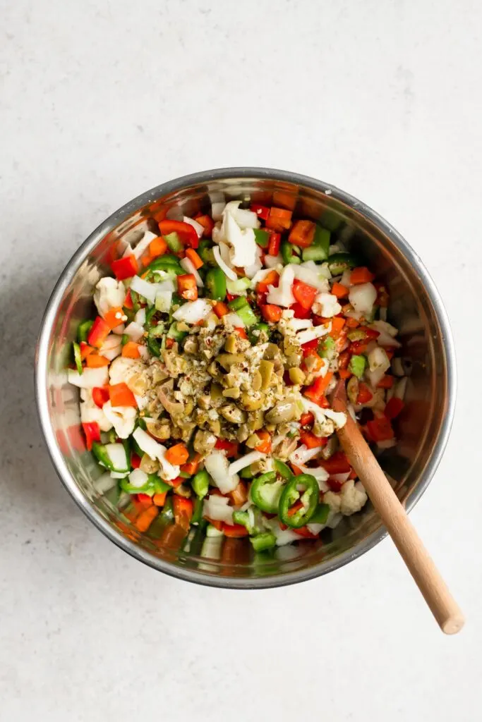 combining the vegetables and the dressing