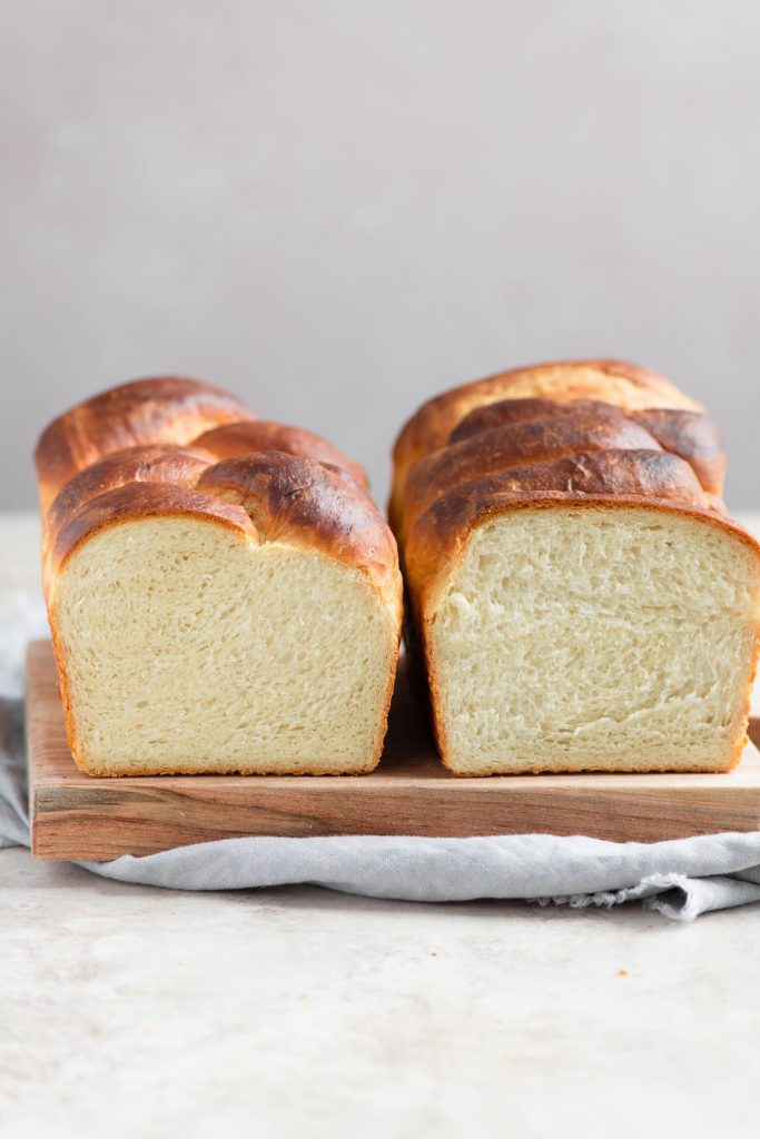 two sliced into loaves of vegan brioche