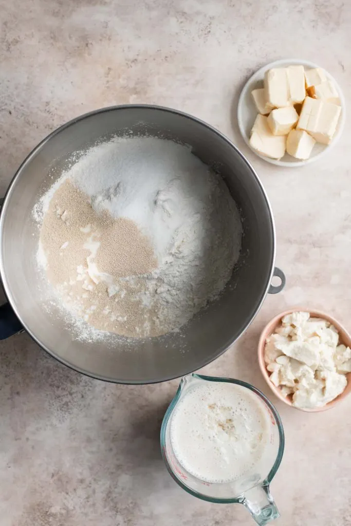 dry ingredients in stand mixer bowl with plant milk, silken tofu, and vegan butter on the side