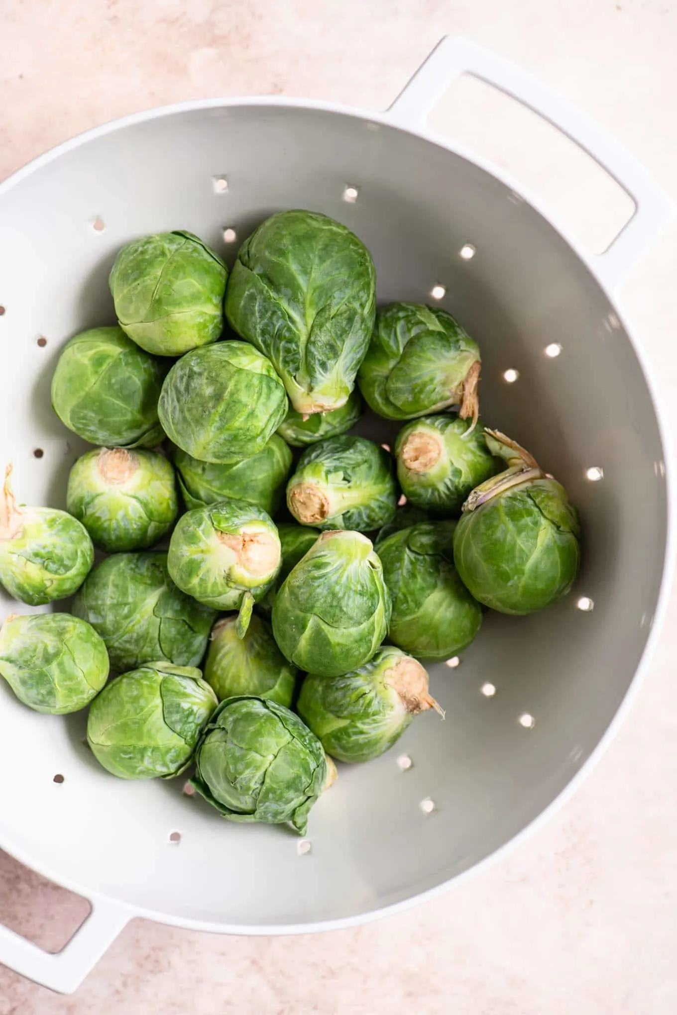 whole brussels sprouts in a strainer
