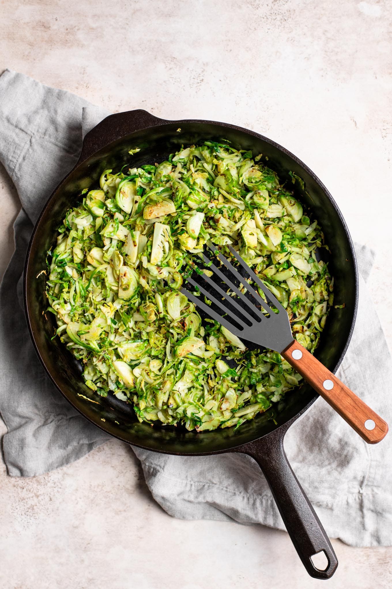 shaved brussels sprouts sautéed in cast iron skillet