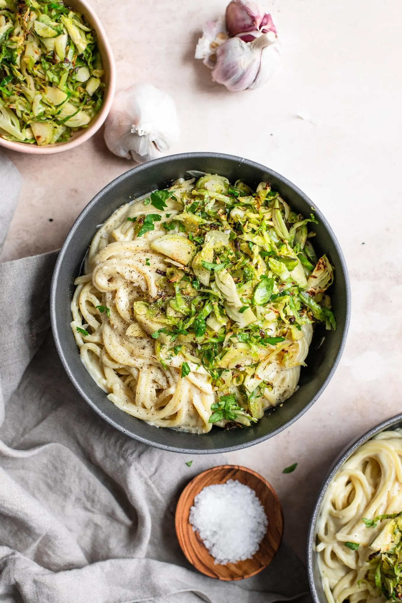 vegan creamy garlic pasta with shaved brussels sprouts