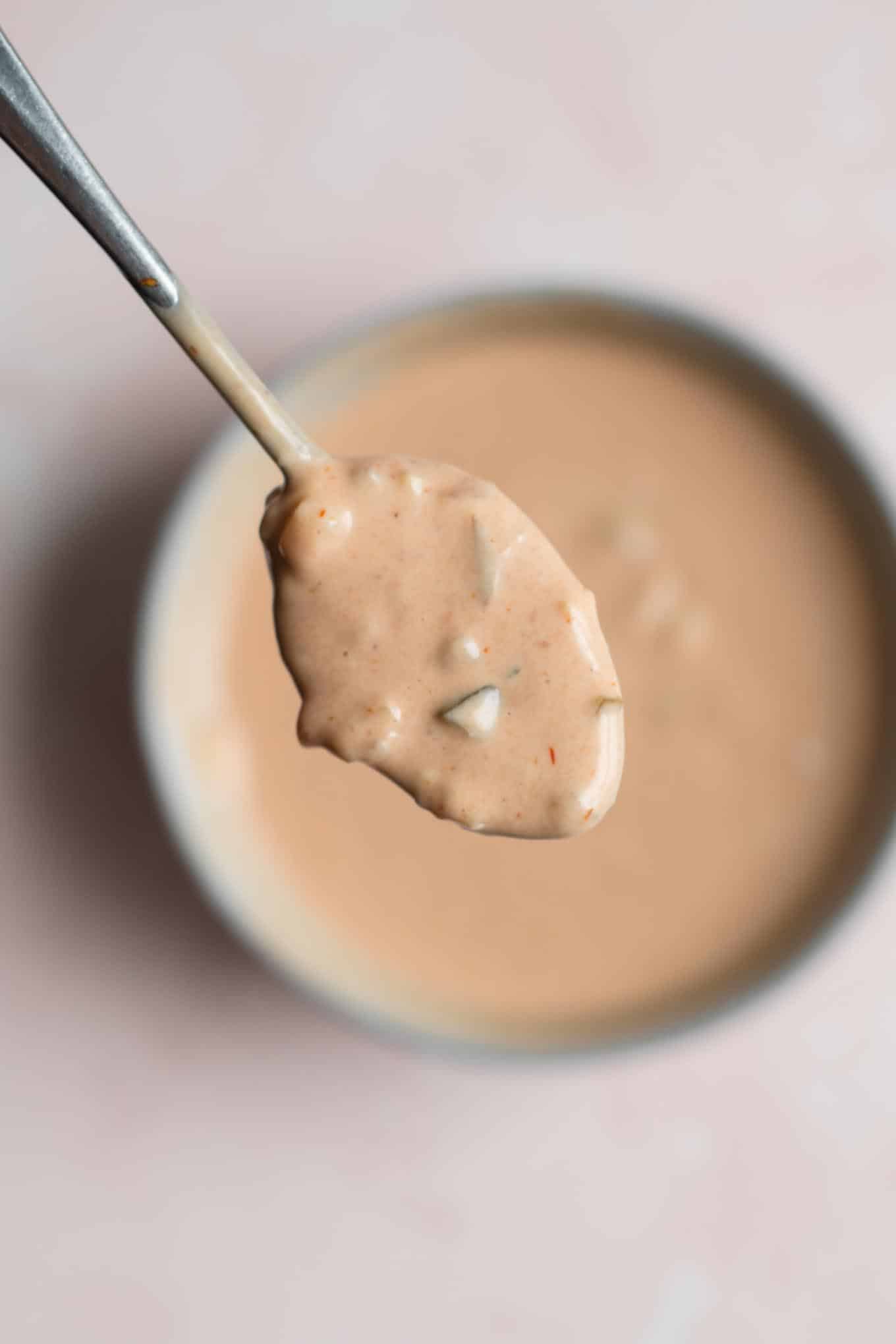 closeup of a spoonful of thousand island dressing