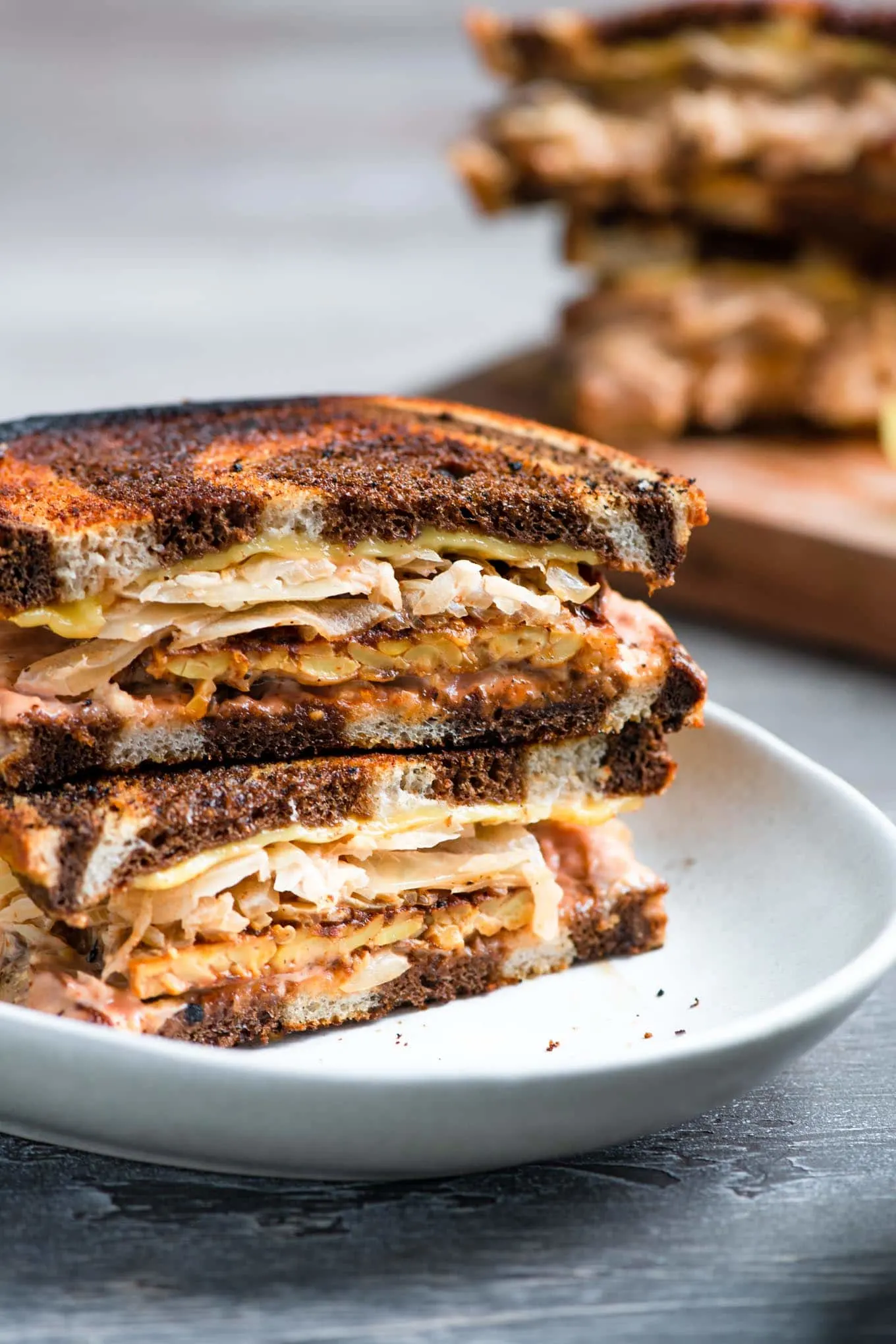 vegan reuben sandwich assembled on a plate