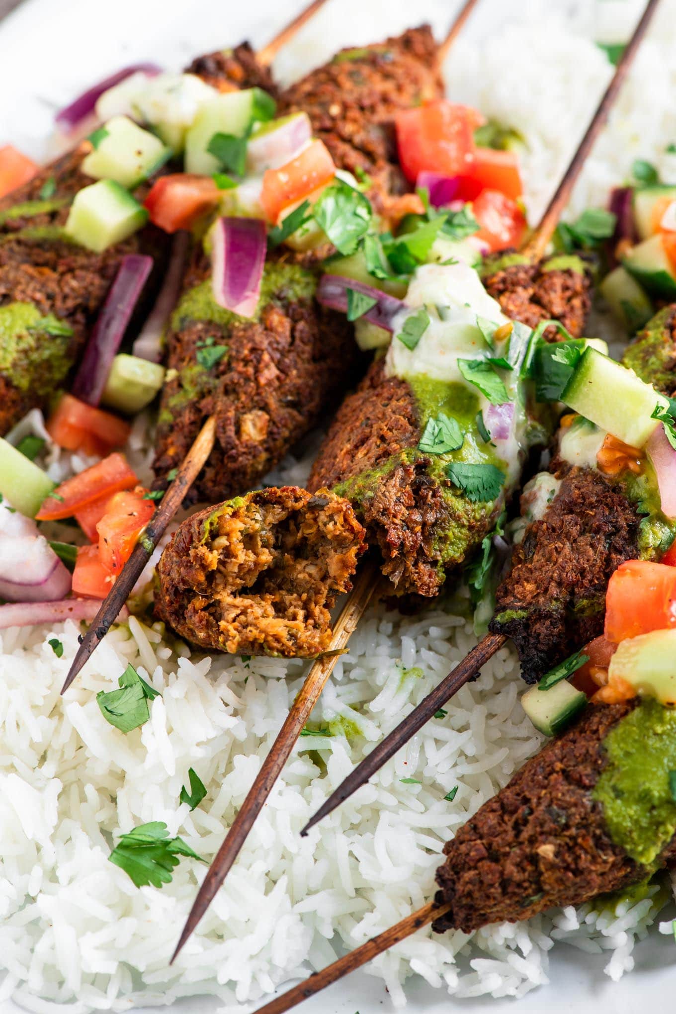 kababs with a close up on a piece broken off to show meaty texture