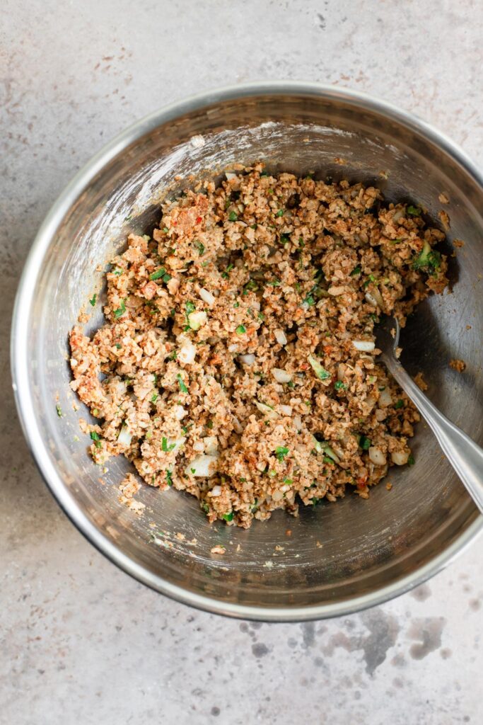 The kabab mixture mixed together in a mixing bowl