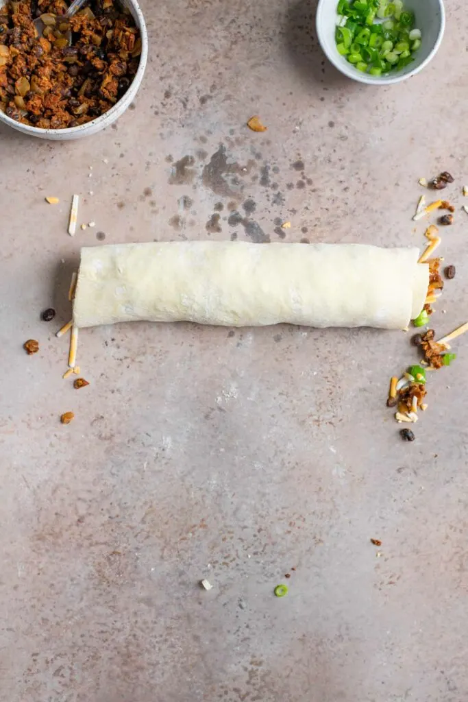 the finished roll of mexican taco filled puff pastry