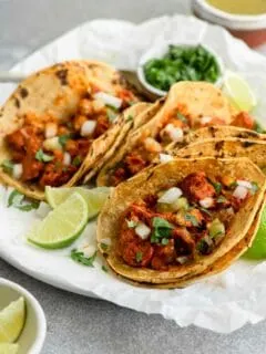 side view of seitan barbacoa in corn tortillas