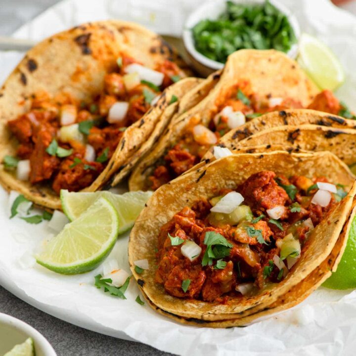 side view of seitan barbacoa in corn tortillas