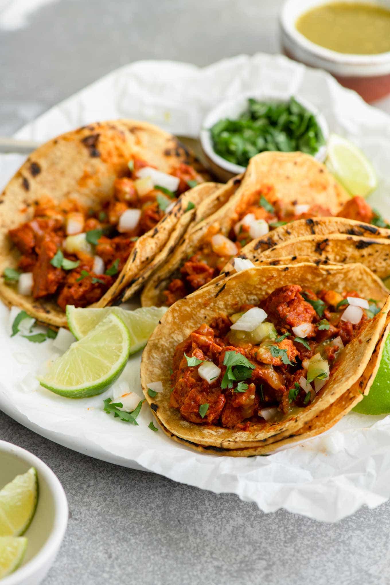side view of seitan barbacoa in corn tortillas