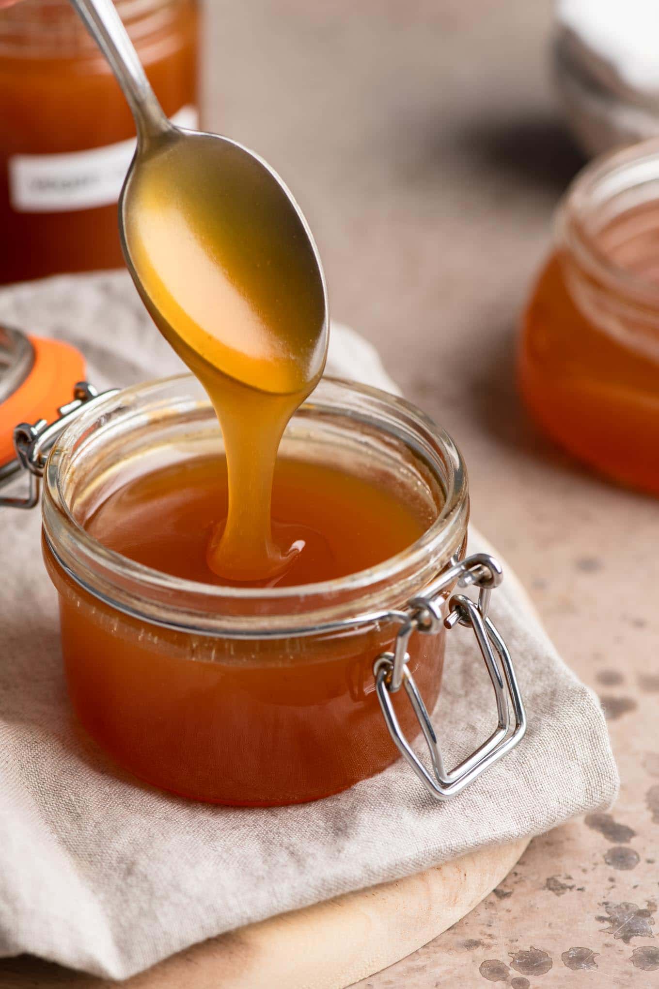 vegan caramel sauce drizzling off spoon