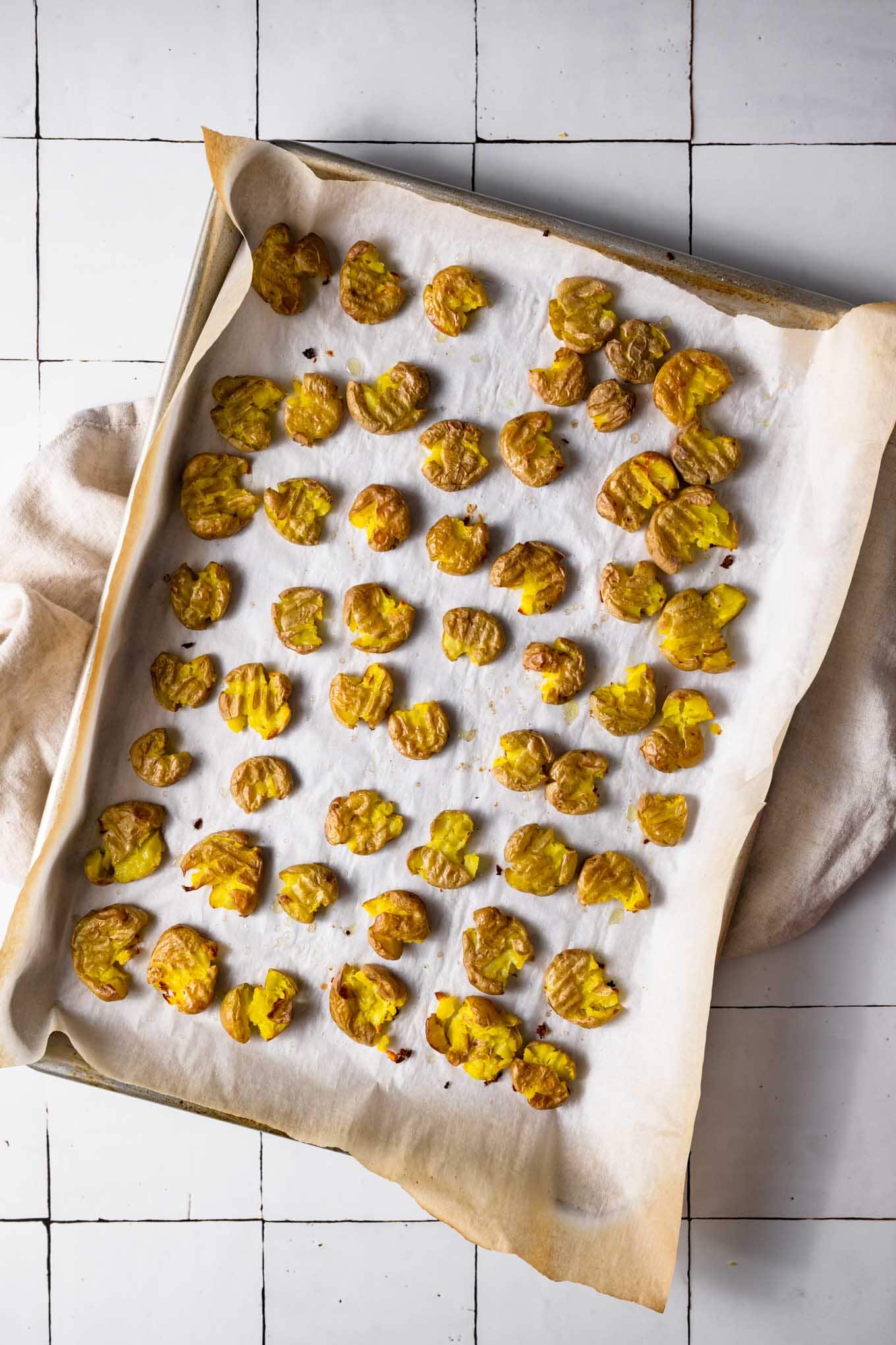 baked smashed potatoes on baking tray