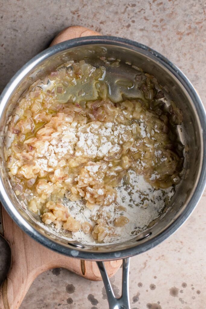 adding flour to the cooked onions