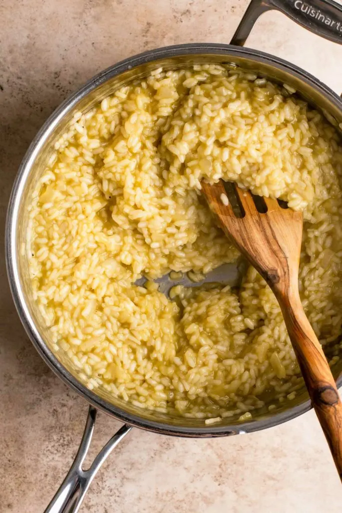 risotto cooking in pot with all the vegetable broth added and the grains of rice cooked through