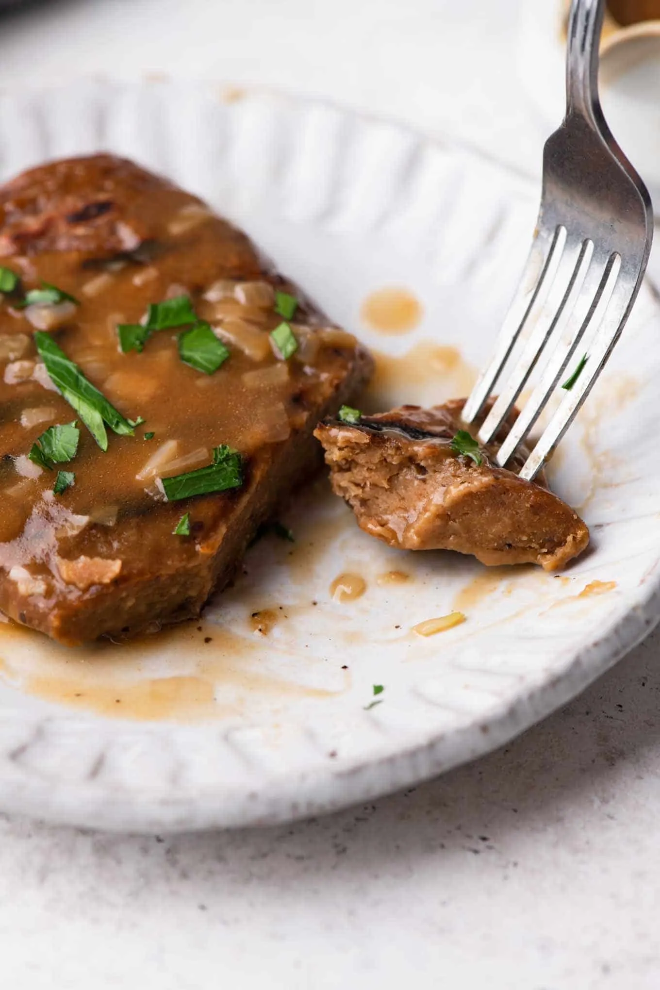 piece of seitan steak on a fork