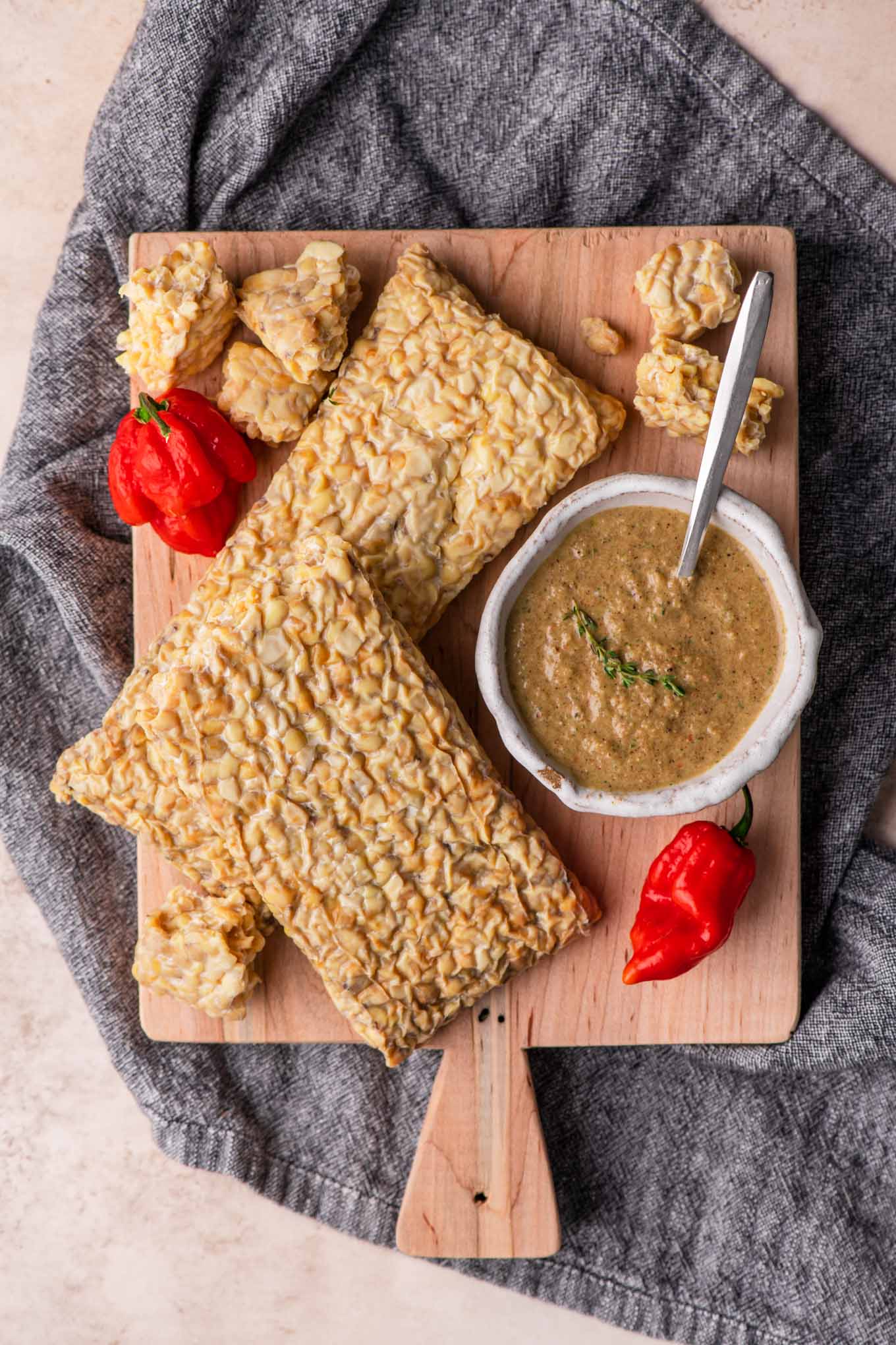 tempeh and jerk sauce on a cutting board