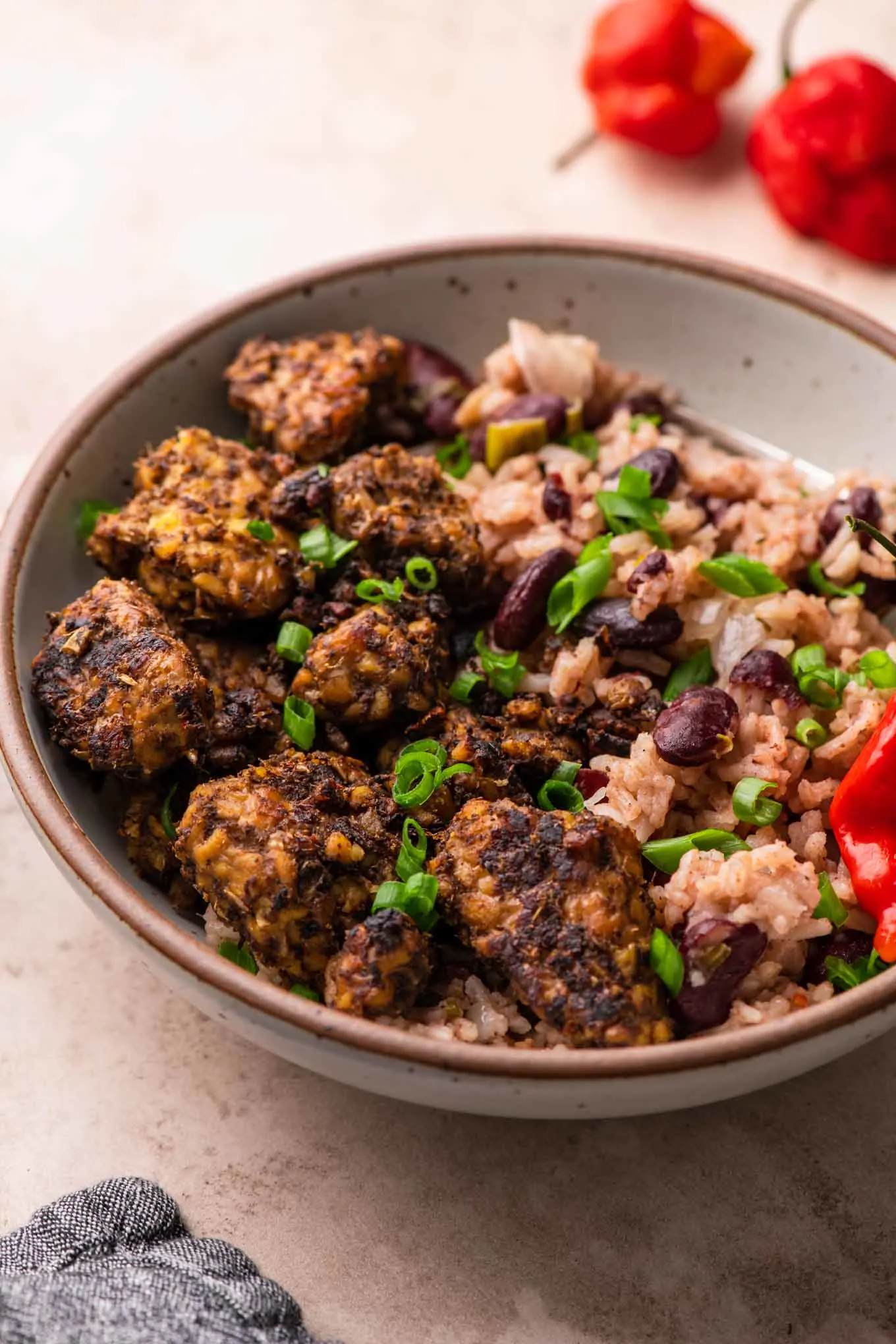 jamaican jerk tempeh served with red beans and rice