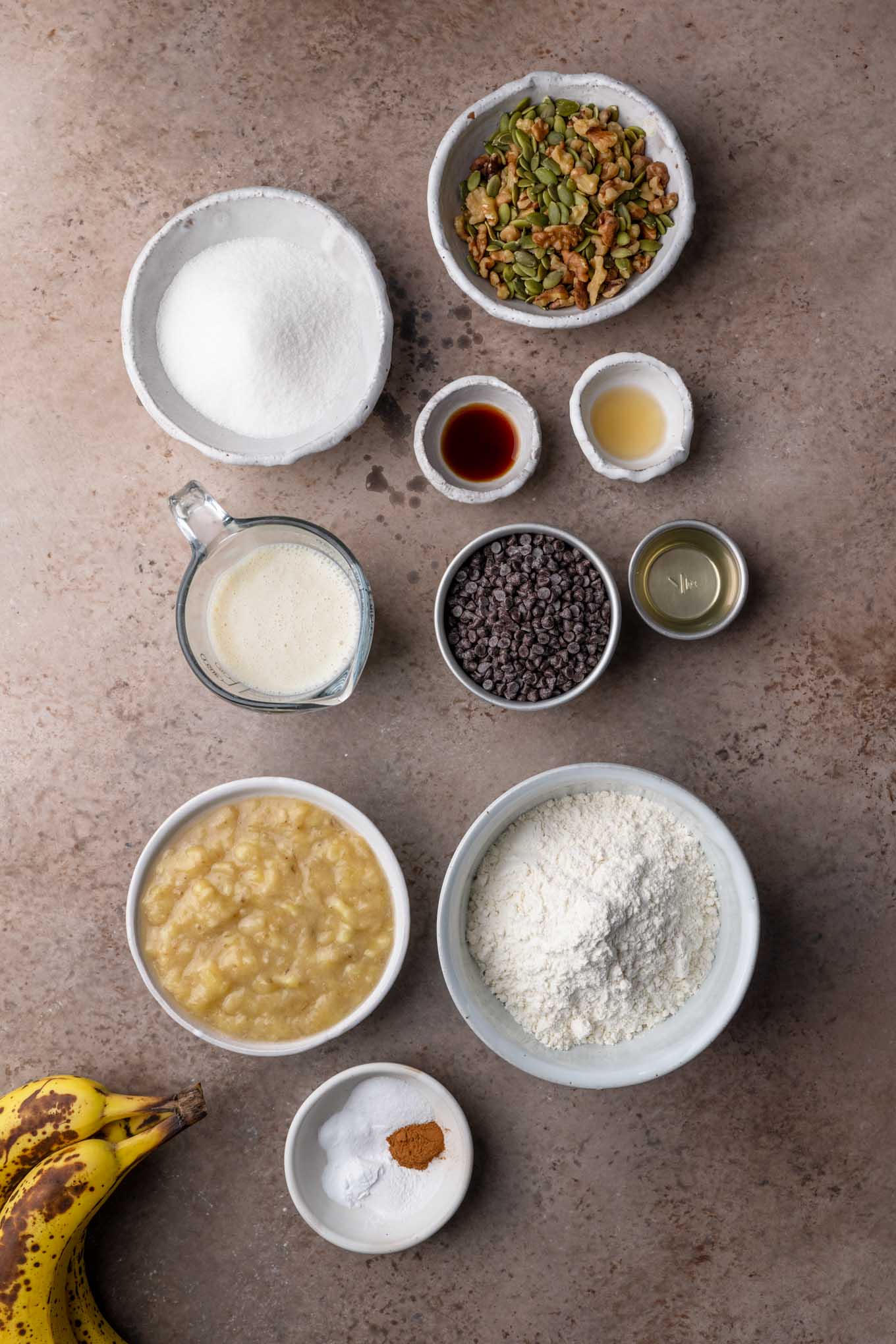 ingredients measured mis en place for vegan chocolate chip banana nut bread