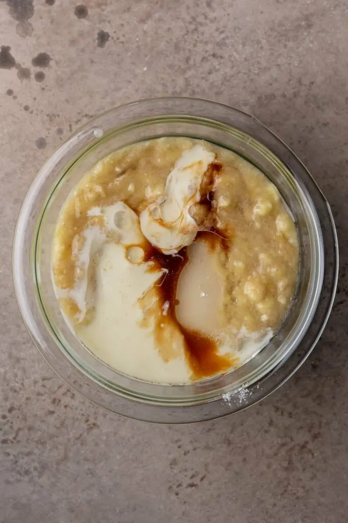 banana bread wet ingredients combined in a glass bowl